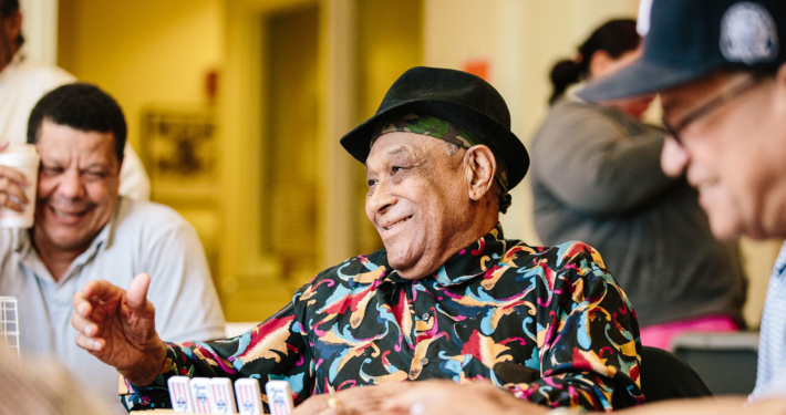 elderly man playing a game at PACE adult day health center